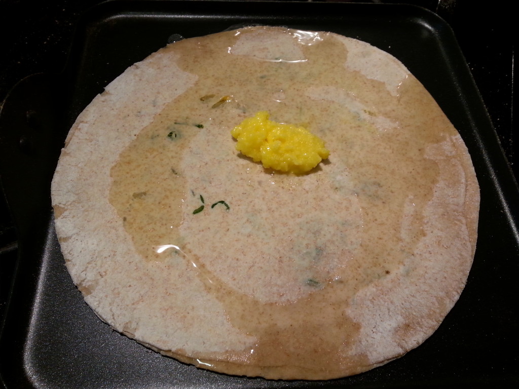 Aloo pyaz paratha (potato and onion paratha) with butter